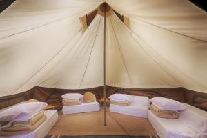Ein Bett oder Betten in einem Zimmer der Unterkunft Retreat Camp Mahoroba