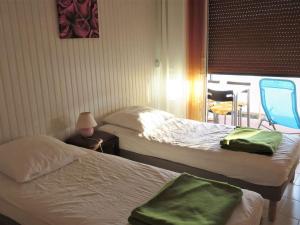Zdjęcie z galerii obiektu T3 climatisé, traversant, 54m², 2 chambres, loggia sud-ouest, parking, cœur de la Favière. - FR-1-610-78 w mieście Bormes-les-Mimosas +7 zdjęć