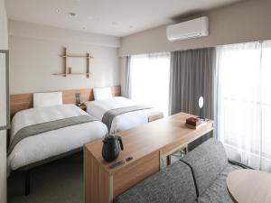 东京浅草筑波快速船舶酒店(Vessel Inn Asakusa Tsukuba Express)房間的床