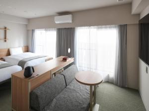东京浅草筑波快速船舶酒店(Vessel Inn Asakusa Tsukuba Express)房間的床