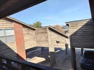 a view of a backyard with a wooden pergola at Golden Sunflower's Apartment B1 in Lawton