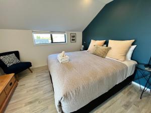 Postel nebo postele na pokoji v ubytování Loft 57