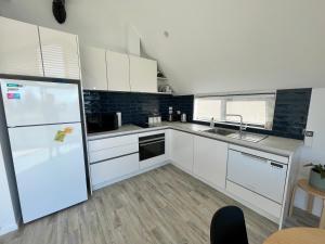 Kuchyň nebo kuchyňský kout v ubytování Loft 57