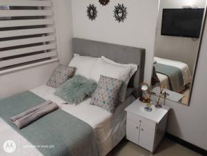 Un ou plusieurs lits dans un hébergement de l'établissement Apartamento sector exclusivo acogedor