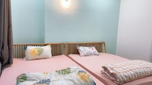 Ένα ή περισσότερα κρεβάτια σε δωμάτιο στο Vũng Tàu Apartmen OSC