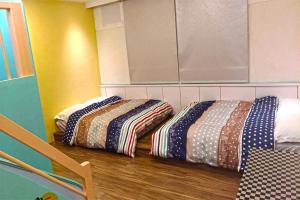 Postel nebo postele na pokoji v ubytování Star Moon Forest Inn