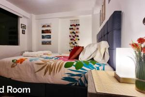Ένα ή περισσότερα κρεβάτια σε δωμάτιο στο Amaru Wasi