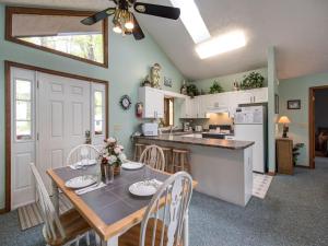 a kitchen and dining room with a table and chairs at Above and Beyond, 2 Bedrooms, Sleeps 6, Private, Amazing View, Hot Tub in Gatlinburg