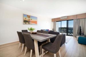 a dining room with a table and some chairs at 507 High Heaven Breathtaking Views, Pool, Parking in Perth