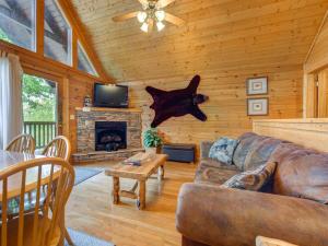 a living room with a couch and a fireplace at Trail’s End, 2 Bedrooms, Hot Tub, Jetted Tub, Gas Fireplace, Sleeps 8 in Gatlinburg
