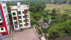 an aerial view of a building next to a river at STAYMAKER Hotel Suraj - Only Indian Citizens Allowed in Haldia