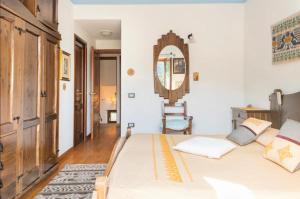 A bed or beds in a room at B&B Su Biancu - Sardinian Experience