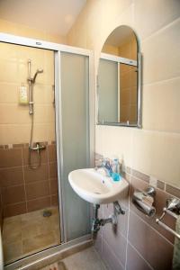 a bathroom with a sink and a shower at Villa Oasis Peyia near Coral Bay in Peyia +8 photos
