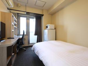 Krevet ili kreveti u jedinici u objektu Dormy Inn EXPRESS Asakusa