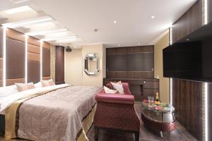 Televisyen dan/atau pusat hiburan di Hotel Pasadena 食べ放題飲み放題 - Couple Hotel