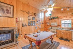 a pool table in a room with a fireplace at Bear Escape, 1 Bedroom, Sleeps 4, Hot Tub, Pool Table, Jacuzzi Tub in Sevierville