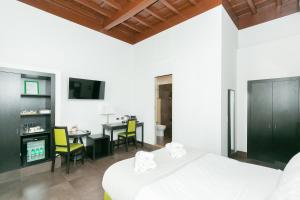 A television and/or entertainment centre at SuitInn19