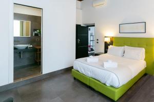 A bed or beds in a room at SuitInn19