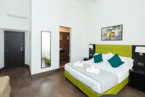 A bed or beds in a room at SuitInn19