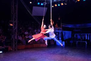 two people are performing on the stage in a performance at Siemreap Vasinh Residence in Siem Reap