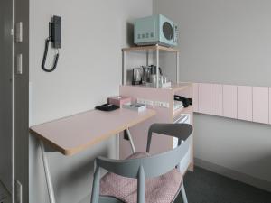 a room with a desk and a chair at Vessel Inn Takadanobaba Ekimae in Tokyo