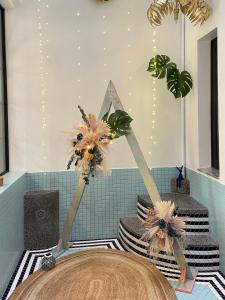 a room with a table with flowers and a mirror at Akasaka Family Villa in Tainan +30 photos