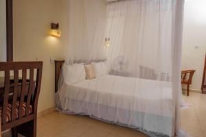 Postel nebo postele na pokoji v ubytování Tristar Hotel Kampala