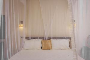 Postel nebo postele na pokoji v ubytování Tristar Hotel Kampala