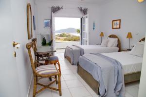 A bed or beds in a room at Aroura Homes 4BR Beachfront Villa