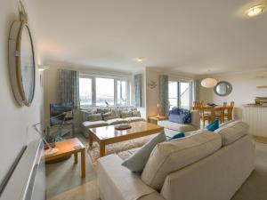 a living room with a couch and a table at 13 Burgh Island Causeway in Bigbury on Sea