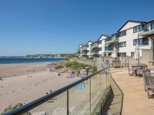 a view of the beach from the balcony of a resort at 13 Burgh Island Causeway in Bigbury on Sea