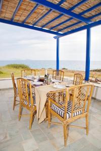A balcony or terrace at Aroura Homes 4BR Beachfront Villa