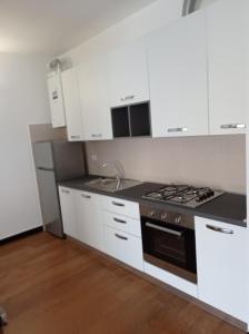 Kuchyň nebo kuchyňský kout v ubytování Profumo di pesto appartamenti Genova