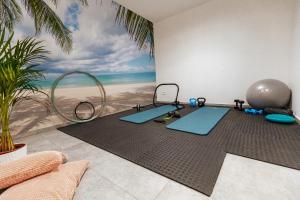 een kamer met een muur met een schilderij van het strand bij Villa Andris-luxury villa near sandy beach - by TRAVELER tourist agency KRK in Ližnjan