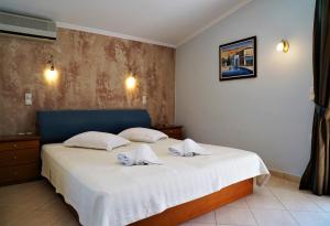 Postel nebo postele na pokoji v ubytování Villa Ilias