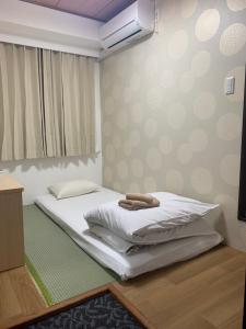 新今宫旅舍客房内的一张或多张床位