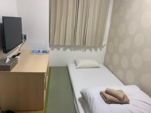 新今宫旅舍客房内的一张或多张床位