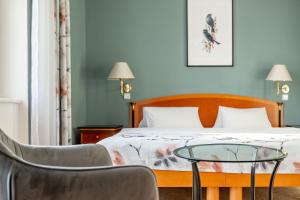 Кровать или кровати в номере Spa & Wellness Hotel Silva