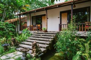 a house with wooden steps in front of it at An Nhien Retreat Phu Quoc with Yoga Daily & Beach access in Phu Quoc +72 photos
