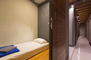 Postel nebo postele na pokoji v ubytování Leisure Hostel