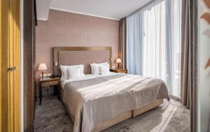 Łóżko lub łóżka w pokoju w obiekcie HAVET Hotel Resort & Spa