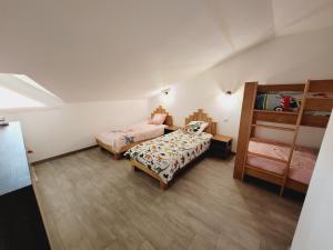a bedroom with two beds and a bunk bed at Escapade Ensoleillée in Mimizan