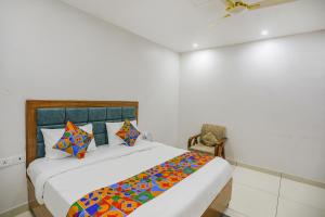 Кровать или кровати в номере FabHotel Well Stay