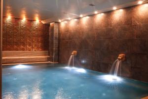 a hot tub in a room with lights in it at Vital Thermal Hotel & SPA in Termal