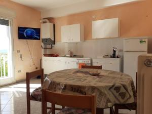 Kuchyň nebo kuchyňský kout v ubytování B&B e Case Vacanze Belvedere