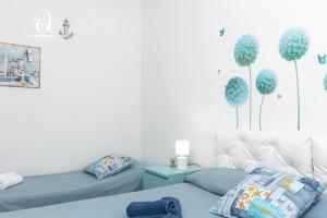 En eller flere senge i et værelse på Castelsardo Marina - Relax a 100 metri dal mare