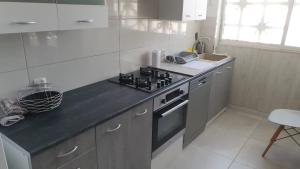a kitchen with a stove and a counter top at Piles playa in La Playa de la Torre de Piles
