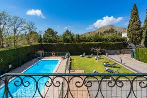 a view of a pool from a balcony of a house at Villa Ocaso by JS Villas in Port de Pollensa