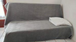 a bed with a pillow on top of it at Mireille in Castellane