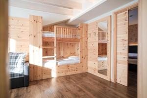 Postel nebo postele na pokoji v ubytování Hotel Piccola Baita